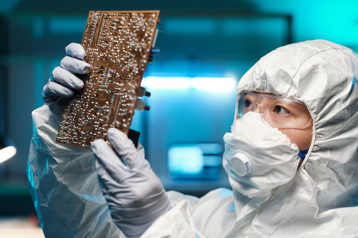 young-repairperson-in-protective-workwear-holding semiconductor manufacturing